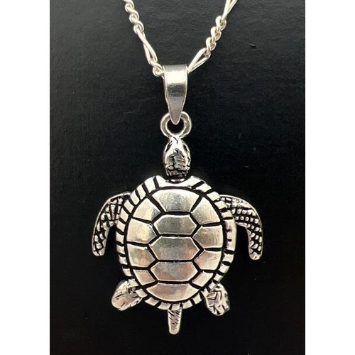 49 - A 925 silver articulated turtle pendant with moving arms, legs & tail. On an 18