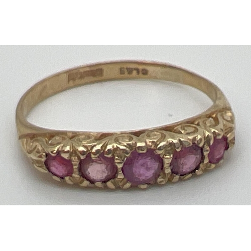 59 - A vintage 9ct and ruby eternity style ring with a scroll design mount. Fully hallmarked inside band.... 