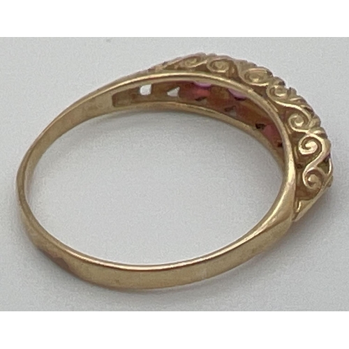 59 - A vintage 9ct and ruby eternity style ring with a scroll design mount. Fully hallmarked inside band.... 