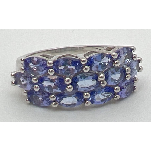 61 - A silver and tanzanite dress ring set with 13 oval cut tanzanite stones. From The Genuine Gem Compan... 