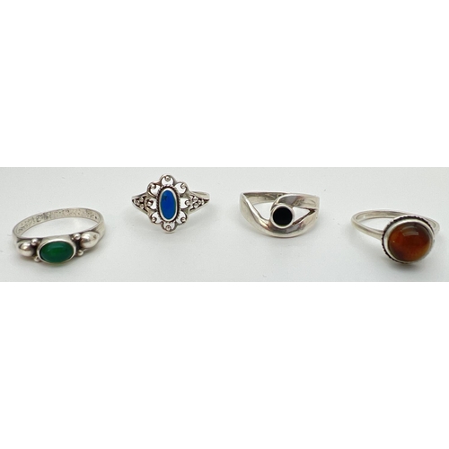 72 - 4 silver stone set dress rings, 1 unmarked, to include Tigers eye, turquoise and onyx. Sizes N, O, O... 