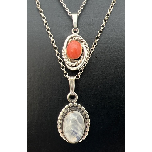 73 - 2 natural stone set silver pendants on silver chains. An oval Moonstone cabochon (approx. 2.5cm drop... 