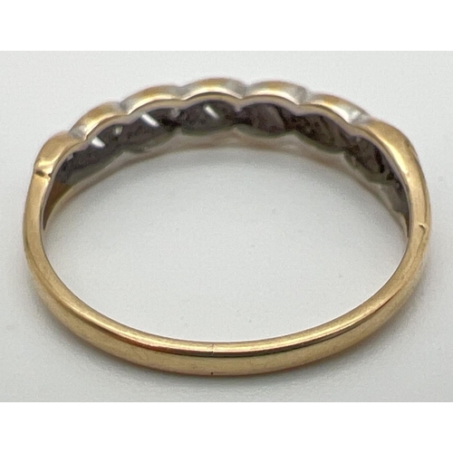 78 - A vintage 9ct gold and diamond eternity style ring with a twisted design setting. Open pierced work ... 