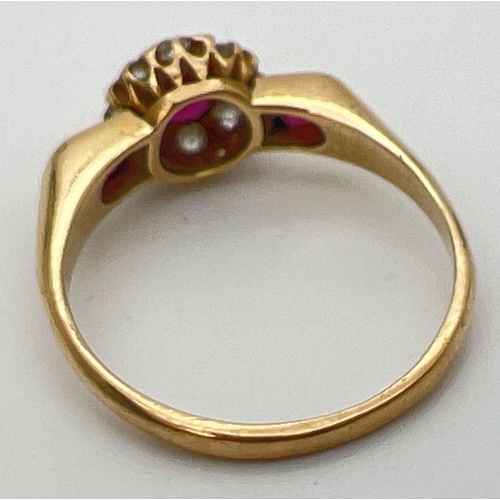 80 - A vintage 18ct gold, ruby and diamond ring with wide shoulder design setting. Central .2ct ruby surr... 