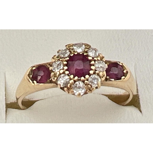 80 - A vintage 18ct gold, ruby and diamond ring with wide shoulder design setting. Central .2ct ruby surr... 