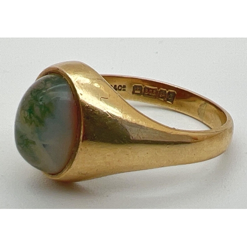 81 - A vintage 9ct gold ring set with central oval cabochon of moss agate. Fully hallmarked inside band. ... 