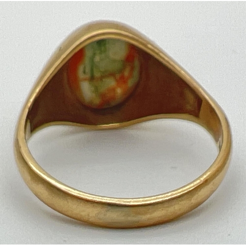 81 - A vintage 9ct gold ring set with central oval cabochon of moss agate. Fully hallmarked inside band. ... 