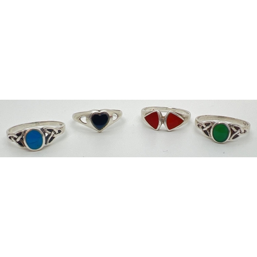 88 - 4 925 silver and natural stone set dress rings, to include 2 of Celtic design. Ring sizes O and O½.