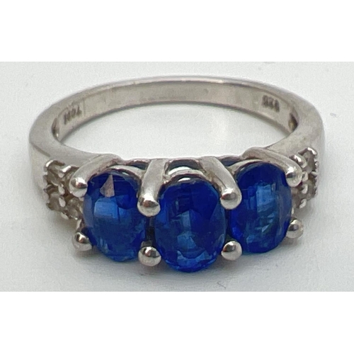 109 - A sterling silver Genuine Gem Company trilogy style ring set with Himalayan Kyanite and white topaz.... 