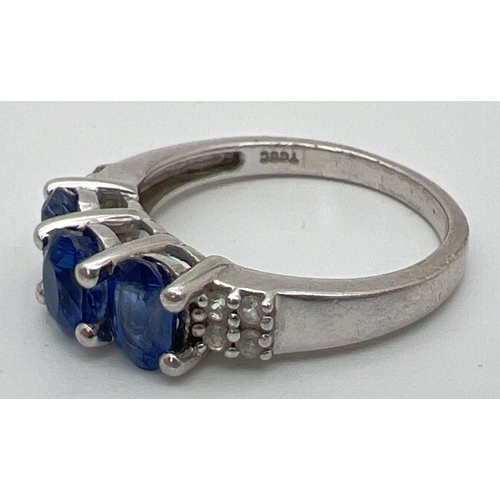 109 - A sterling silver Genuine Gem Company trilogy style ring set with Himalayan Kyanite and white topaz.... 