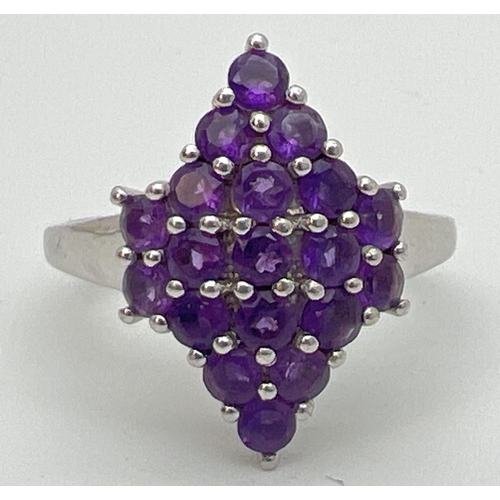 110 - A sterling silver Genuine Gem Company Zambian amethyst ring in a diamond shaped setting. Complete wi... 