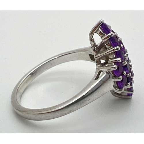 110 - A sterling silver Genuine Gem Company Zambian amethyst ring in a diamond shaped setting. Complete wi... 