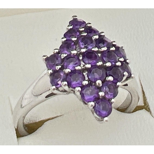 110 - A sterling silver Genuine Gem Company Zambian amethyst ring in a diamond shaped setting. Complete wi... 