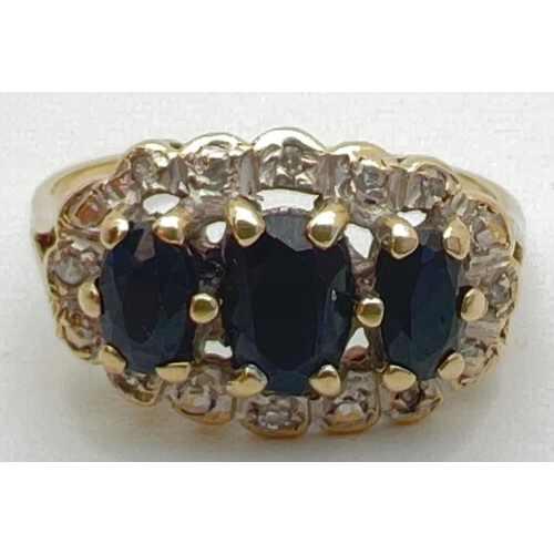 112 - A vintage 9ct gold sapphire and diamond ring trilogy style ring with a halo setting. 3 large oval cu... 