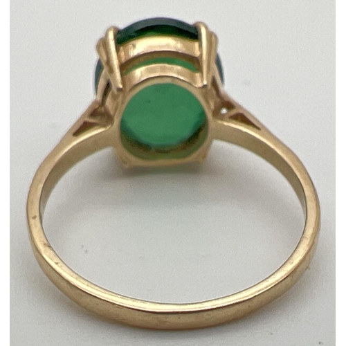 113 - A 9ct gold ring set with large oval cut green beryl stone with claw setting. Stone approx. 12mm x 9m... 