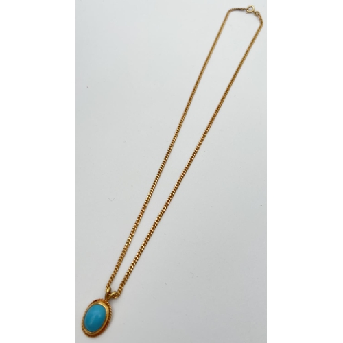 114 - A turquoise and 9ct gold oval shaped pendant on an 18