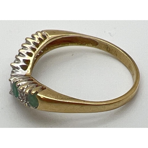 116 - A 9ct gold emerald and diamond wishbone ring set with alternating emeralds and illusion set diamonds... 