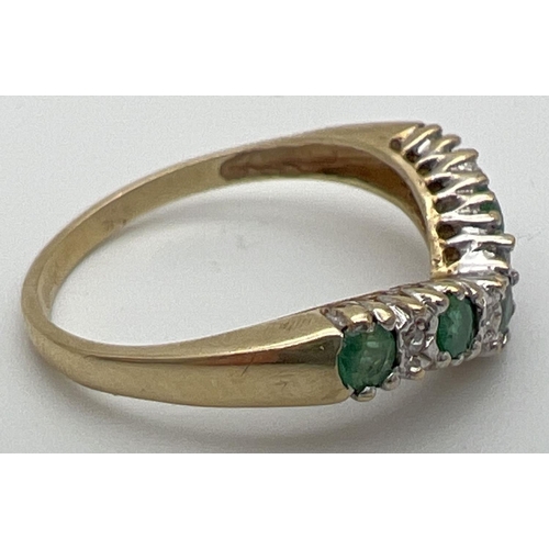 116 - A 9ct gold emerald and diamond wishbone ring set with alternating emeralds and illusion set diamonds... 