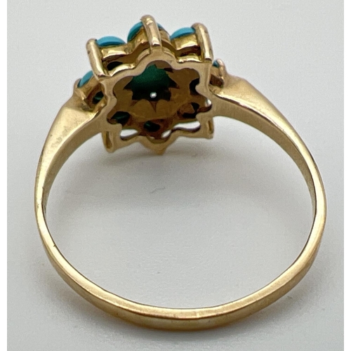 134 - A 9ct gold and turquoise dress ring with 9 cabochons in a flower shaped setting. Fully hallmarked in... 