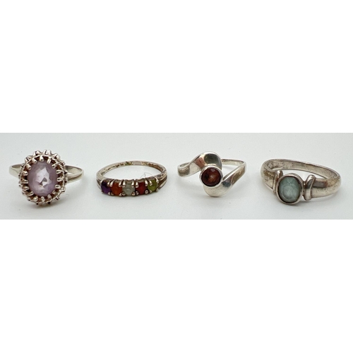 135 - 4 silver stone set rings, in varying styles, 1 unmarked. Sizes from N to P.