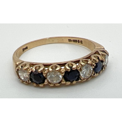 138 - A vintage 9ct gold sapphire and cubic zirconia eternity ring, size M½. Fully hallmarked inside band.... 