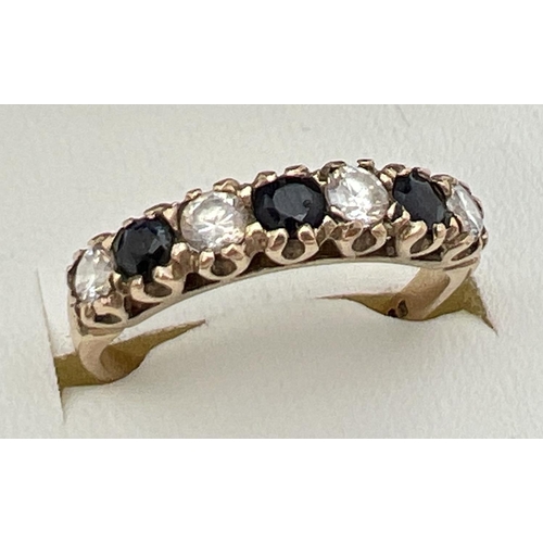 138 - A vintage 9ct gold sapphire and cubic zirconia eternity ring, size M½. Fully hallmarked inside band.... 