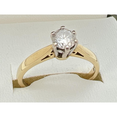 142 - An 18ct gold .5ct diamond solitaire ring in a cathedral setting. Fully hallmarked inside band and al... 