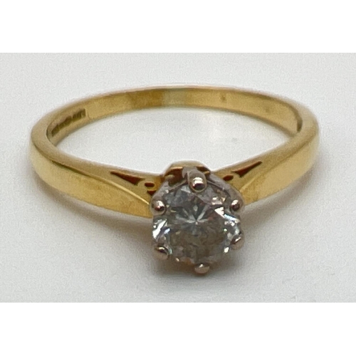 142 - An 18ct gold .5ct diamond solitaire ring in a cathedral setting. Fully hallmarked inside band and al... 