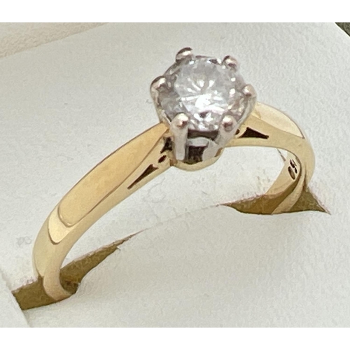 142 - An 18ct gold .5ct diamond solitaire ring in a cathedral setting. Fully hallmarked inside band and al... 