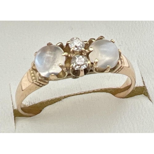 149 - A vintage unmarked yellow metal cats eye style ring set with moonstone & white topaz. Band unmarked ... 