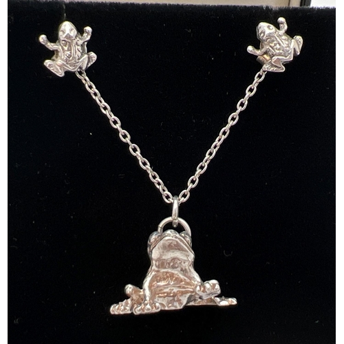 152 - A white metal pendant modelled as a frog, on an 18