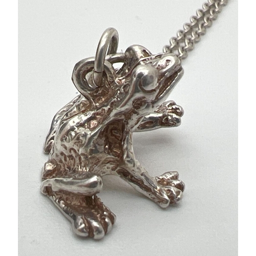 152 - A white metal pendant modelled as a frog, on an 18