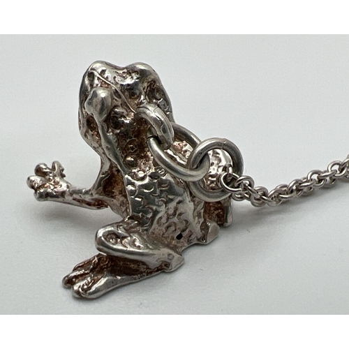 152 - A white metal pendant modelled as a frog, on an 18