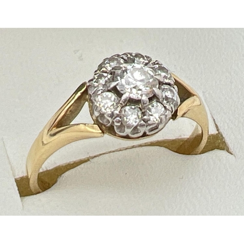 154 - An 18ct gold and diamond cluster ring, set with 9 round cut diamonds in a circular shaped mount. Ful... 