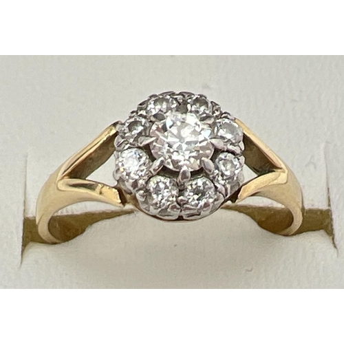 154 - An 18ct gold and diamond cluster ring, set with 9 round cut diamonds in a circular shaped mount. Ful... 