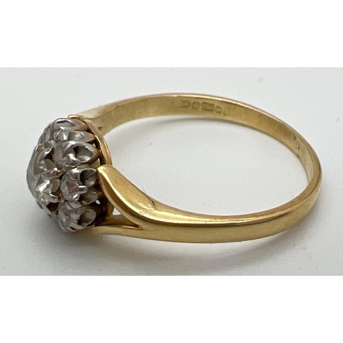 154 - An 18ct gold and diamond cluster ring, set with 9 round cut diamonds in a circular shaped mount. Ful... 