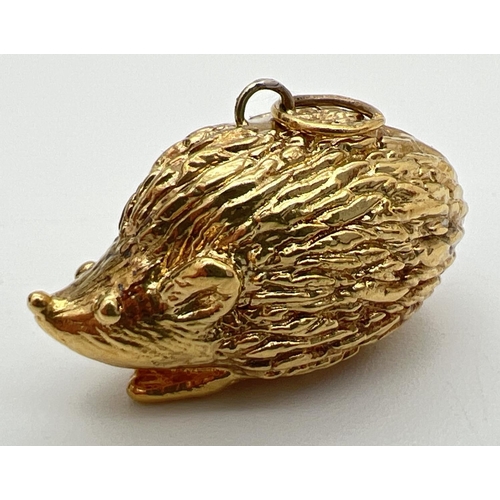 156 - A hollow 9ct gold pendant modelled as a hedgehog, with hanging bale. Bale fully hallmarked, pendant ... 