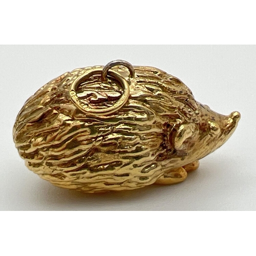 156 - A hollow 9ct gold pendant modelled as a hedgehog, with hanging bale. Bale fully hallmarked, pendant ... 