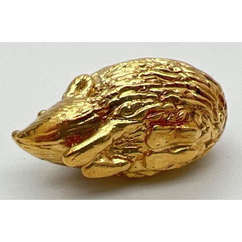 156 - A hollow 9ct gold pendant modelled as a hedgehog, with hanging bale. Bale fully hallmarked, pendant ... 