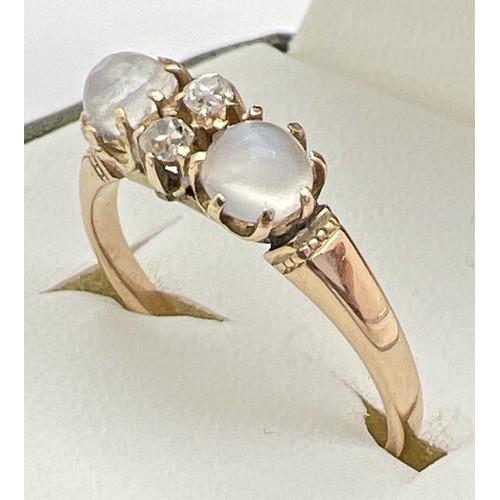 149 - A vintage unmarked yellow metal cats eye style ring set with moonstone & white topaz. Band unmarked ... 