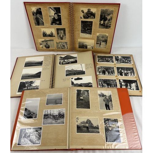 229 - 4 vintage Japanese photograph albums containing various pictures of people, transport, buildings and... 