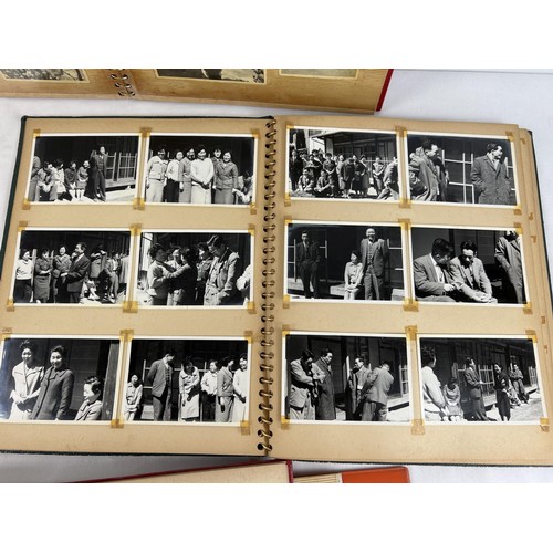 229 - 4 vintage Japanese photograph albums containing various pictures of people, transport, buildings and... 