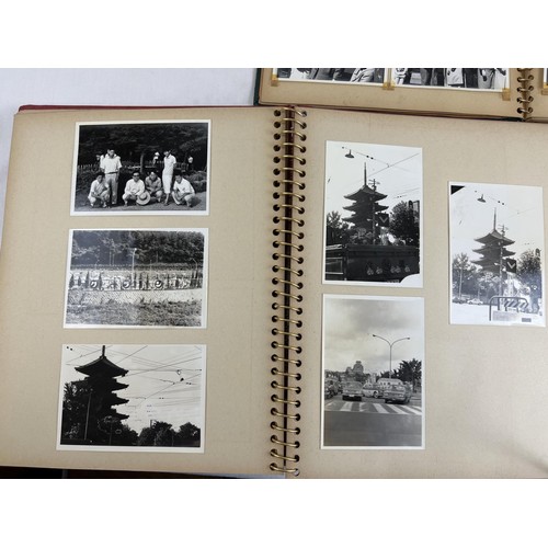 229 - 4 vintage Japanese photograph albums containing various pictures of people, transport, buildings and... 