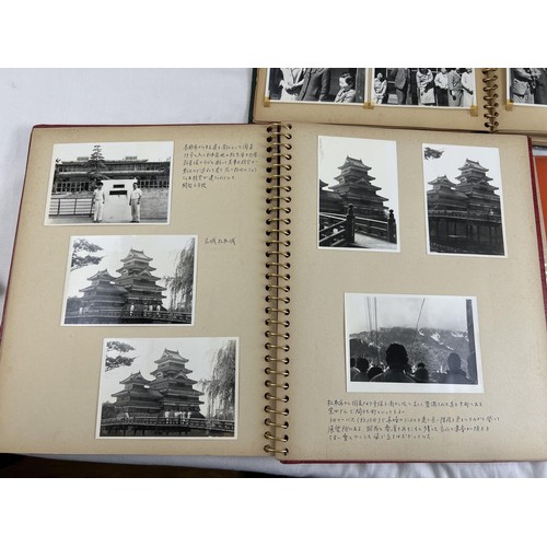 229 - 4 vintage Japanese photograph albums containing various pictures of people, transport, buildings and... 