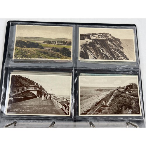 123 - An album containing 60 assorted Edwardian and vintage Norfolk postcards, to include RP's. Destinatio... 