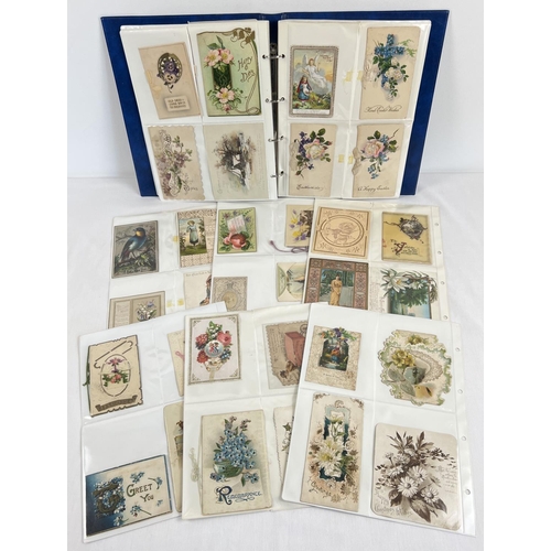 125 - An album of 150+ Late Victorian/Edwardian greetings cards. To include glittered, ribbon and envelope... 