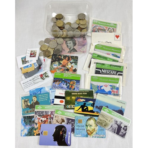 252 - A small collection of mixed ephemera. To include, BT phone cards, British and foreign vintage coins ... 