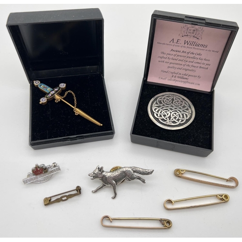 1013 - A small collection of costume jewellery brooches and pins. To include a sword shaped micro mosaic se... 