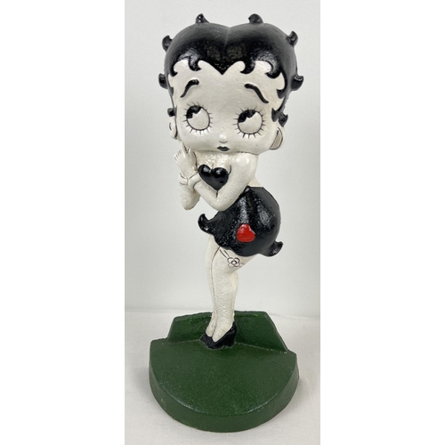 1168 - A painted cast metal flat backed door stop featuring Betty Boop. Approx. 36cm tall and weighs 2.3kg.