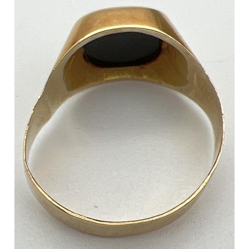 1029 - A men's 20ct gold and black onyx signet ring, band slightly misshapen. Stamped 83.5 inside band. Rin... 